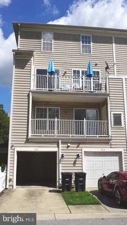 a front view of a house with a street