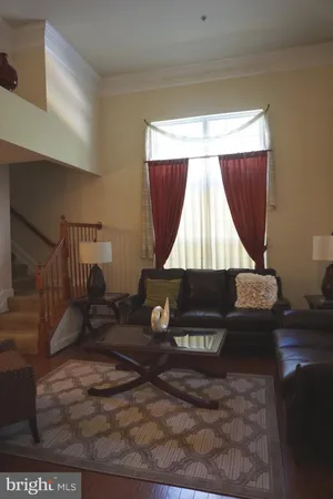 a room with wooden floor and a window