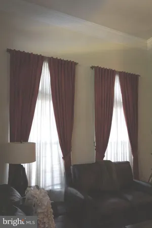 a view of wooden floor and windows in a room