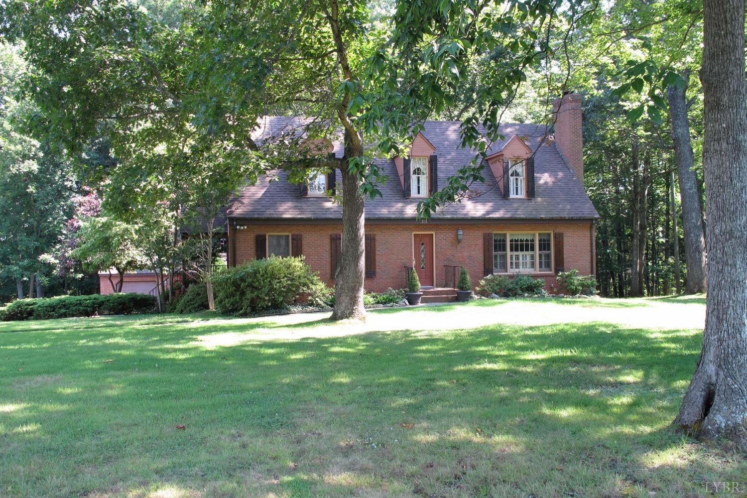 211 Sunset Drive Amherst, VA 24521 - Photo 2 of 76 a front view of a house with a yard and trees