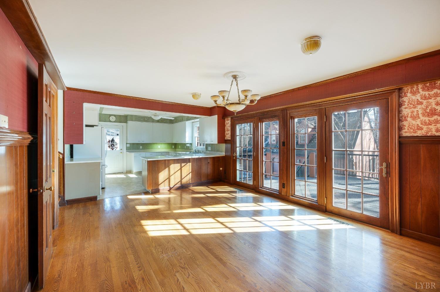 211 Sunset Drive Amherst, VA 24521 - Photo 27 of 76 a view of a living room with a large window and wooden floor