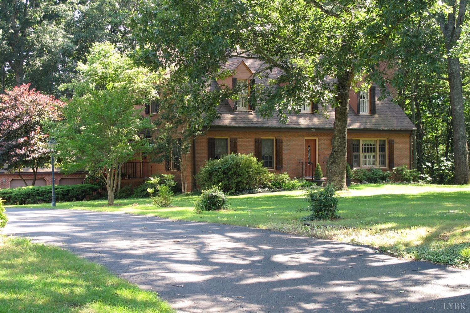 211 Sunset Drive Amherst, VA 24521 - Photo 3 of 76 a front view of a house with a yard and garage