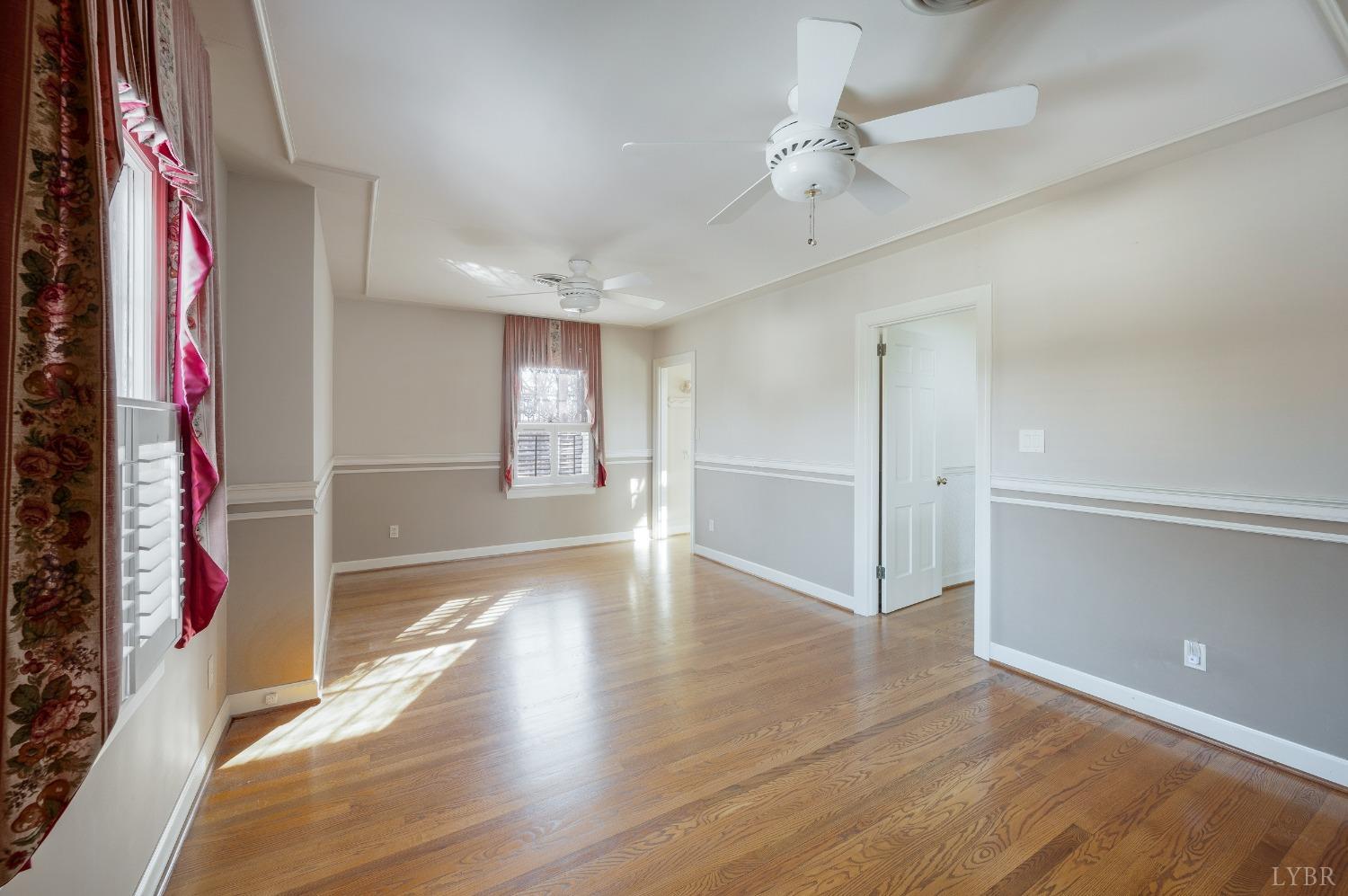 211 Sunset Drive Amherst, VA 24521 - Photo 35 of 76 wooden floor in an empty room with a window