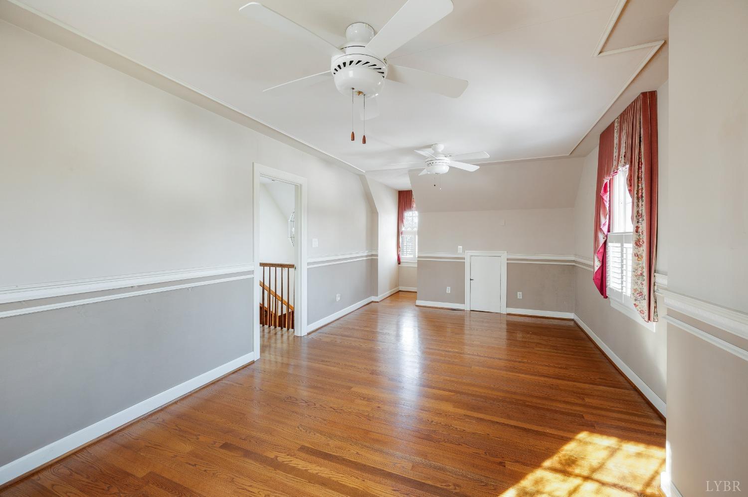 211 Sunset Drive Amherst, VA 24521 - Photo 36 of 76 a view of an empty room with wooden floor and a window