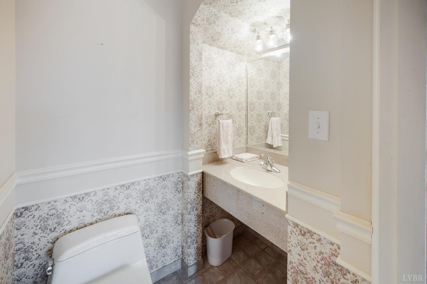 211 Sunset Drive Amherst, VA 24521 - Photo 40 of 76 a bathroom with a sink a toilet and vanity
