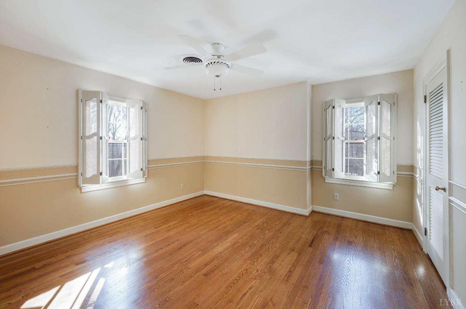 211 Sunset Drive Amherst, VA 24521 - Photo 46 of 76 a view of an empty room with wooden floor and a window
