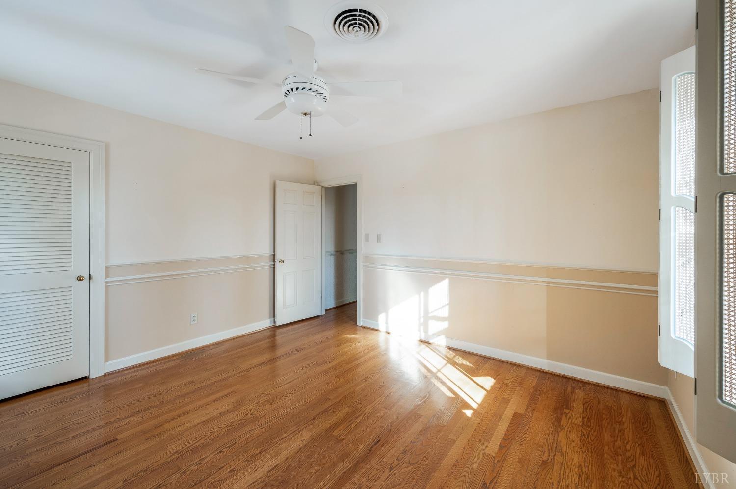 211 Sunset Drive Amherst, VA 24521 - Photo 47 of 76 a view of empty room with wooden floor