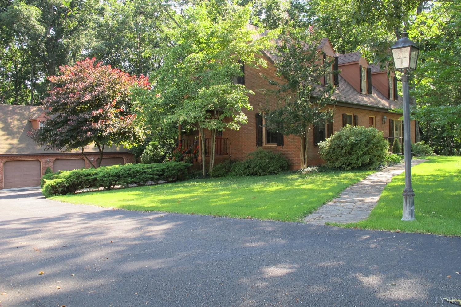 211 Sunset Drive Amherst, VA 24521 - Photo 5 of 76 a front view of a house with a yard and a garage