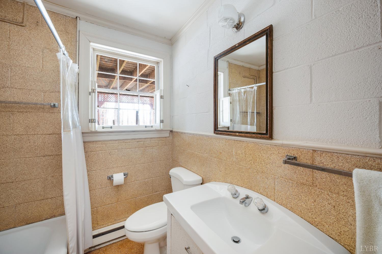 211 Sunset Drive Amherst, VA 24521 - Photo 52 of 76 a bathroom with a sink and a toilet