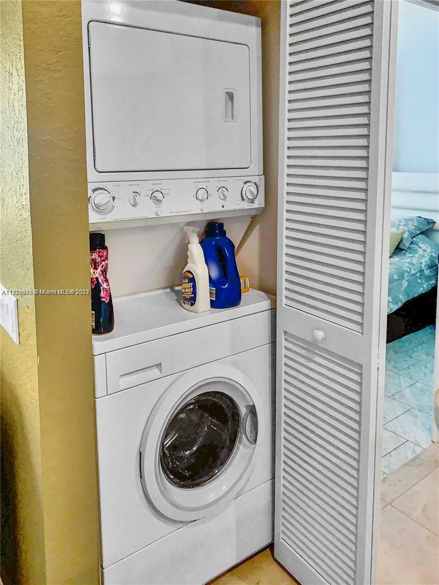 3150 Laurel Ridge Circle, Unit 3150 Riviera Beach, FL 33404 - Photo 18 of 18 a utility room with dryer and washer
