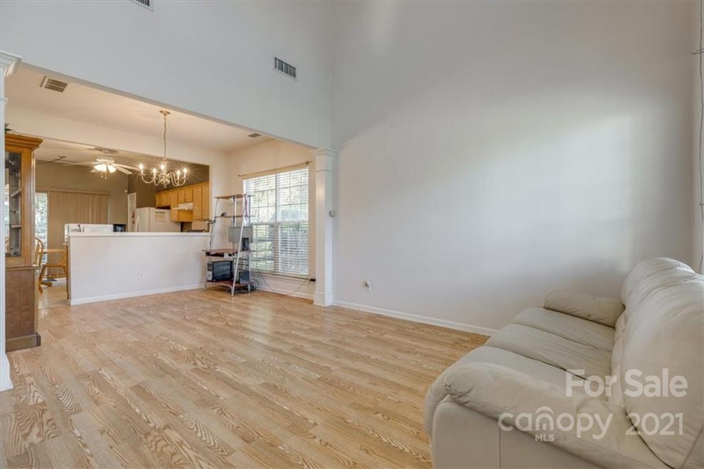 14014 Dingess Road Charlotte, NC 28273 - Photo 11 of 38 a view of a livingroom with a white furniture and window