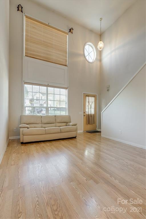 14014 Dingess Road Charlotte, NC 28273 - Photo 12 of 38 a view of a room with window and hardwood floor