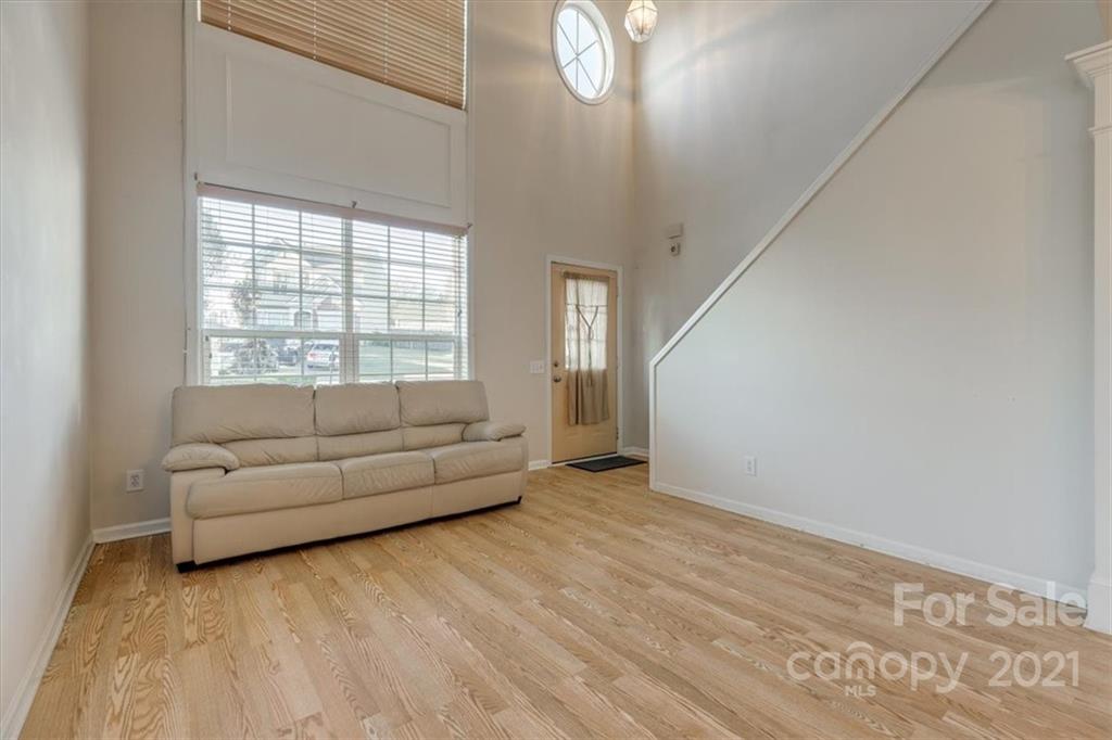 14014 Dingess Road Charlotte, NC 28273 - Photo 13 of 38 a living room with furniture and a large window