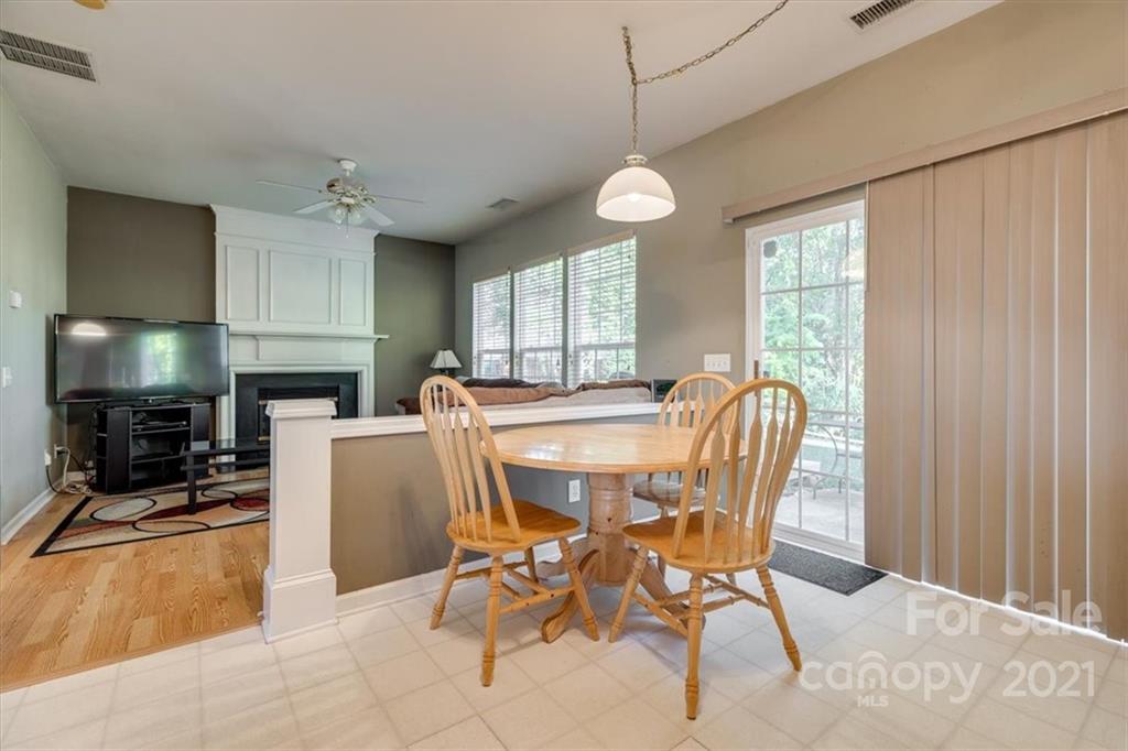 14014 Dingess Road Charlotte, NC 28273 - Photo 16 of 38 a view of a dining room with furniture window and outside view