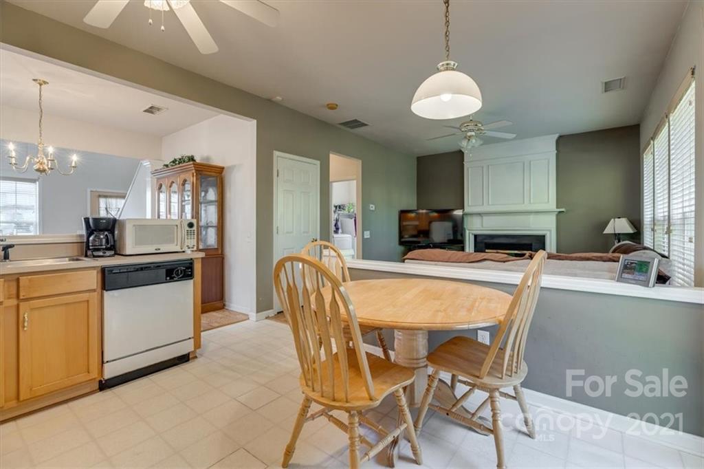 14014 Dingess Road Charlotte, NC 28273 - Photo 17 of 38 a large kitchen with a table and chairs