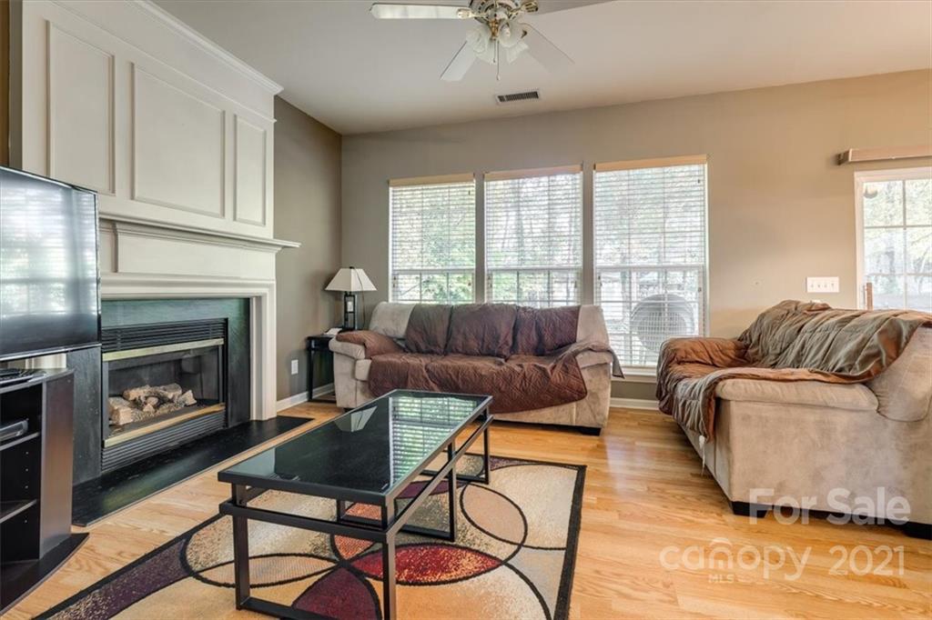 14014 Dingess Road Charlotte, NC 28273 - Photo 19 of 38 a living room with furniture and a fireplace
