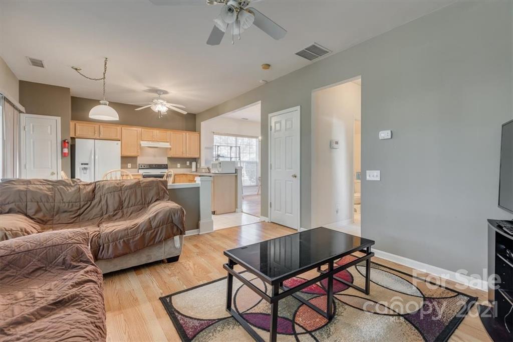 14014 Dingess Road Charlotte, NC 28273 - Photo 21 of 38 a living room with furniture and kitchen view