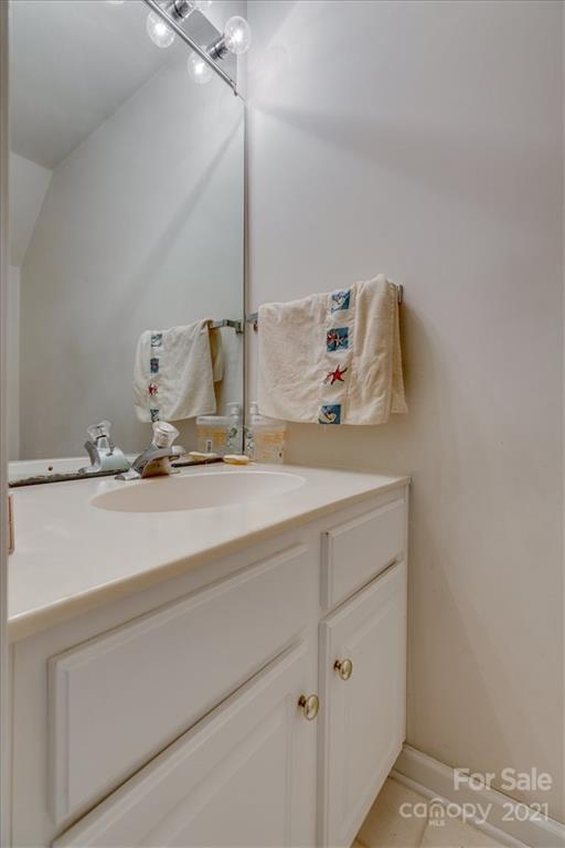 14014 Dingess Road Charlotte, NC 28273 - Photo 27 of 38 a bathroom with a sink and vanity