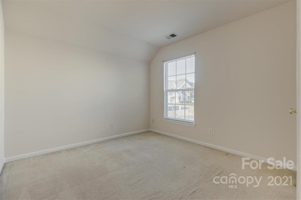 14014 Dingess Road Charlotte, NC 28273 - Photo 31 of 38 an empty room with a window