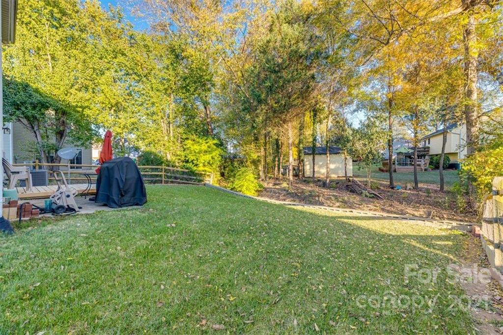 14014 Dingess Road Charlotte, NC 28273 - Photo 37 of 38 a view of a garden with trees