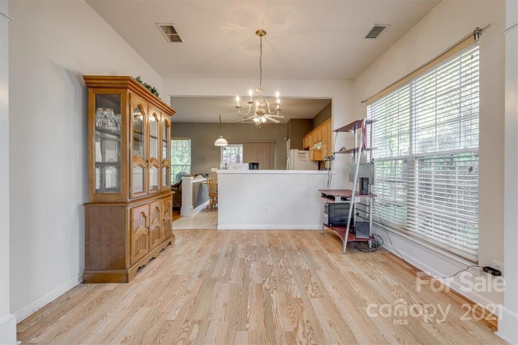 14014 Dingess Road Charlotte, NC 28273 - Photo 7 of 38 a view of a livingroom with furniture window and wooden floor