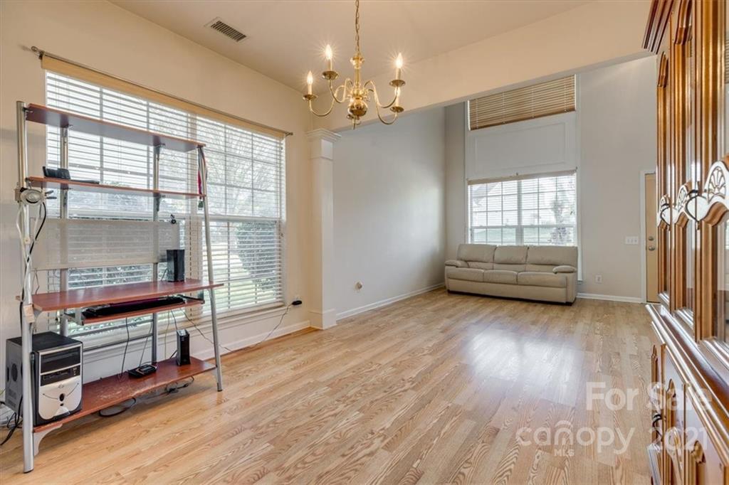 14014 Dingess Road Charlotte, NC 28273 - Photo 9 of 38 a view of livingroom with furniture wooden floor and windows