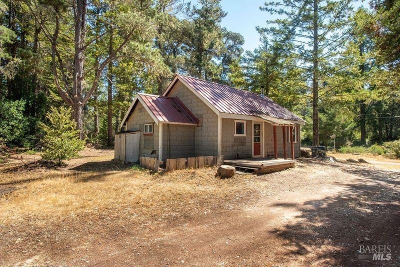 27500 Tenmile Road Gualala, CA 95445 - Photo 1 of 1 a view of a house with snow on the road