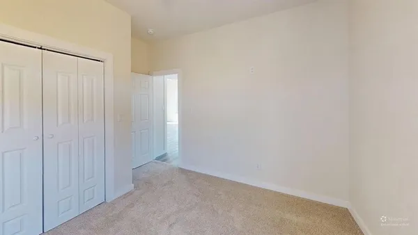 a view of a room with an empty space