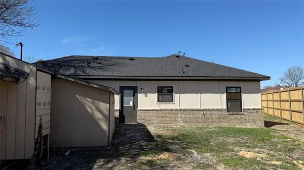 a house view with a backyard space