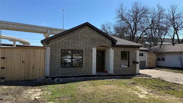a front view of a house with garage
