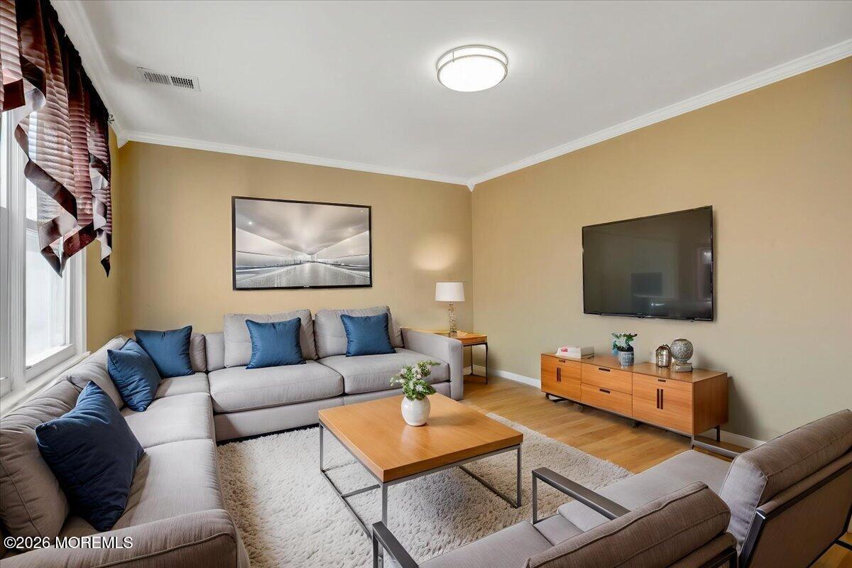 16 Regina Drive Howell, NJ 07731 - Photo 14 of 33 a living room with furniture and a flat screen tv