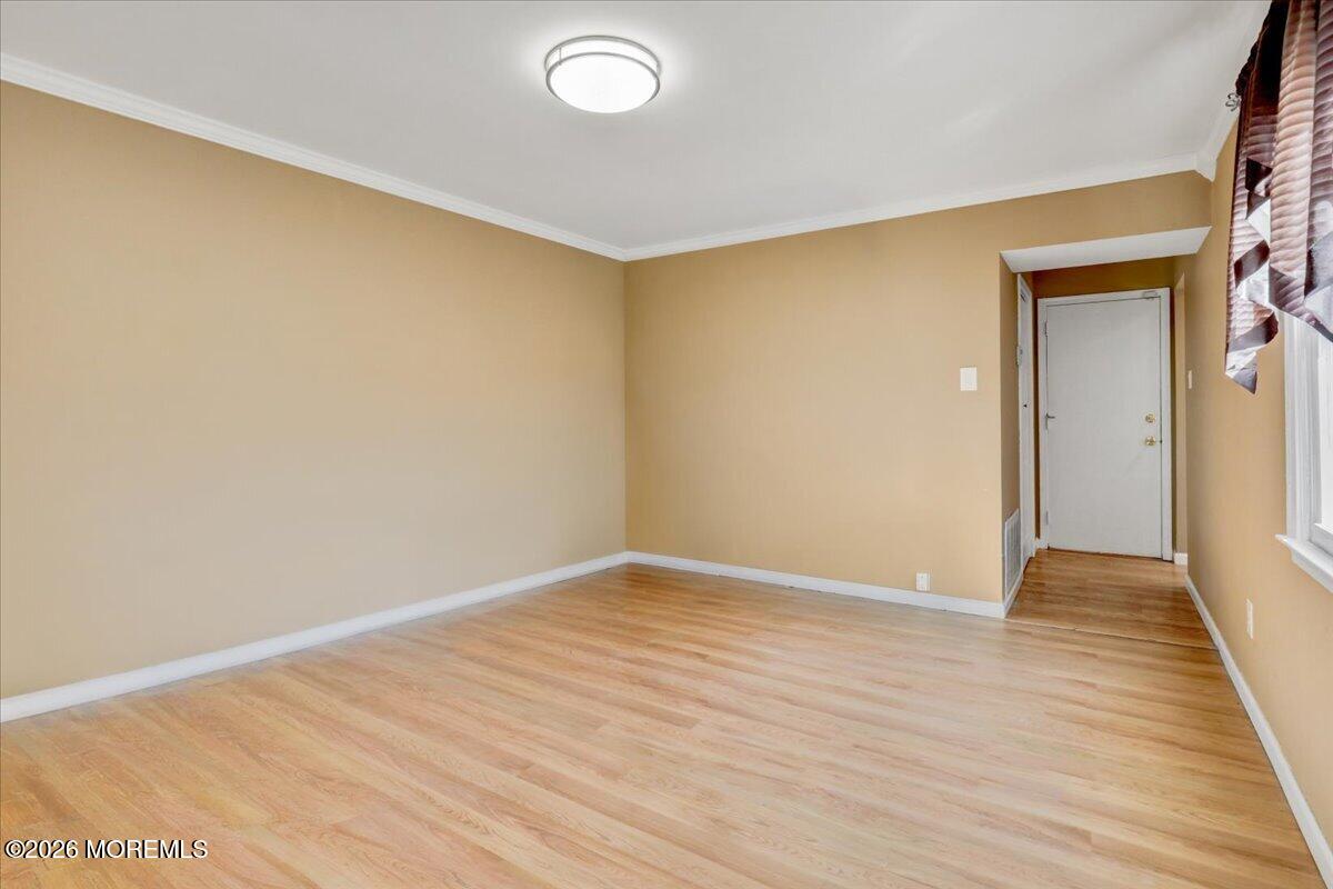 16 Regina Drive Howell, NJ 07731 - Photo 16 of 33 a view of an empty room with wooden floor