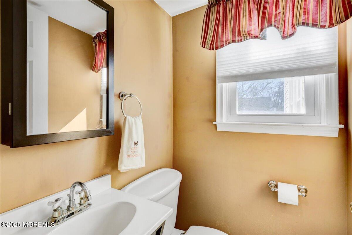 16 Regina Drive Howell, NJ 07731 - Photo 17 of 33 a bathroom with a sink toilet and mirror