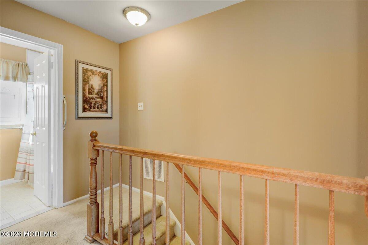 16 Regina Drive Howell, NJ 07731 - Photo 18 of 33 a view of staircase with railing and a window