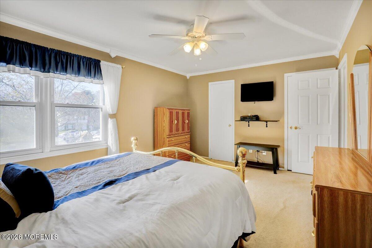 16 Regina Drive Howell, NJ 07731 - Photo 22 of 33 a bedroom with a bed and a couch