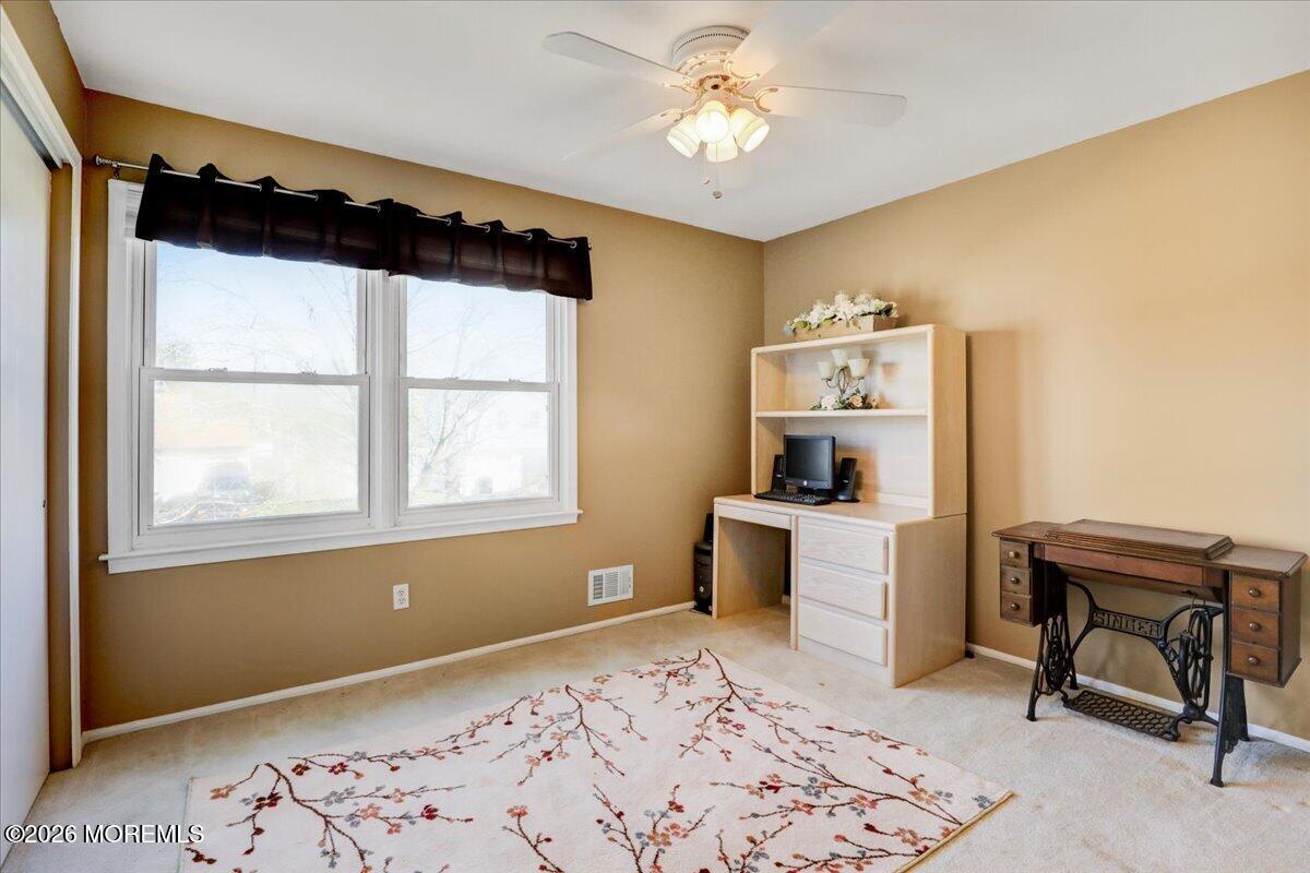 16 Regina Drive Howell, NJ 07731 - Photo 24 of 33 a living room with a bed furniture and a window