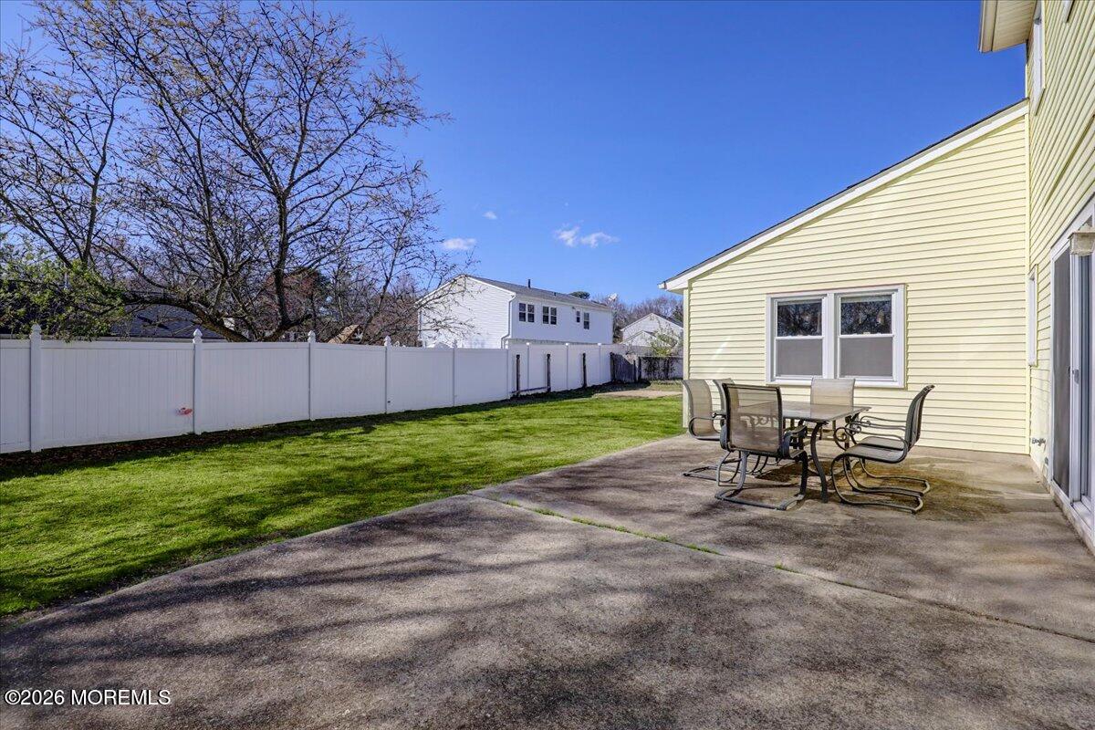 16 Regina Drive Howell, NJ 07731 - Photo 28 of 33 a view of a backyard with table and chair