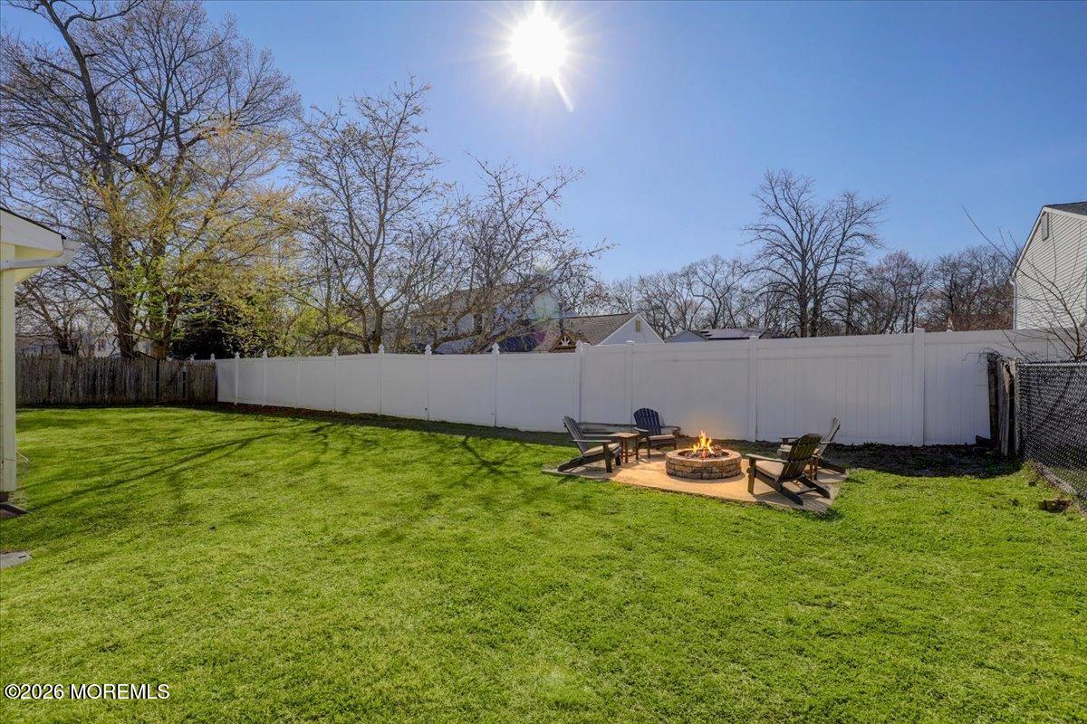 16 Regina Drive Howell, NJ 07731 - Photo 30 of 33 a backyard of a house with table and chairs