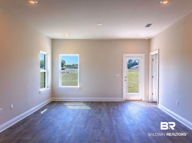 13791 Logan Place Foley, AL 36535 - Photo 10 of 25 Open room featuring wood-finish flooring and recessed lighting