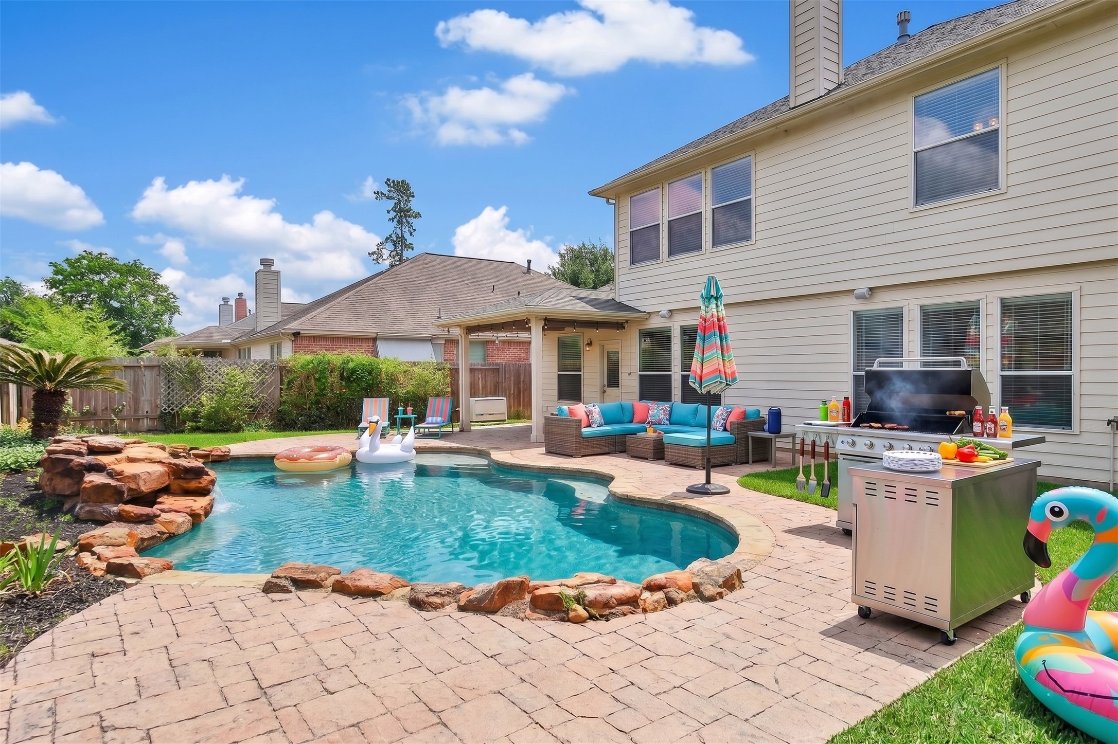 2215 2 Trail Drive Spring, TX 77373 - Photo 2 of 46 This photo is virtually staged to give an idea of the amount of fun you will have in this amazing backyard oasis! There's nothing like a good AI BBQ!