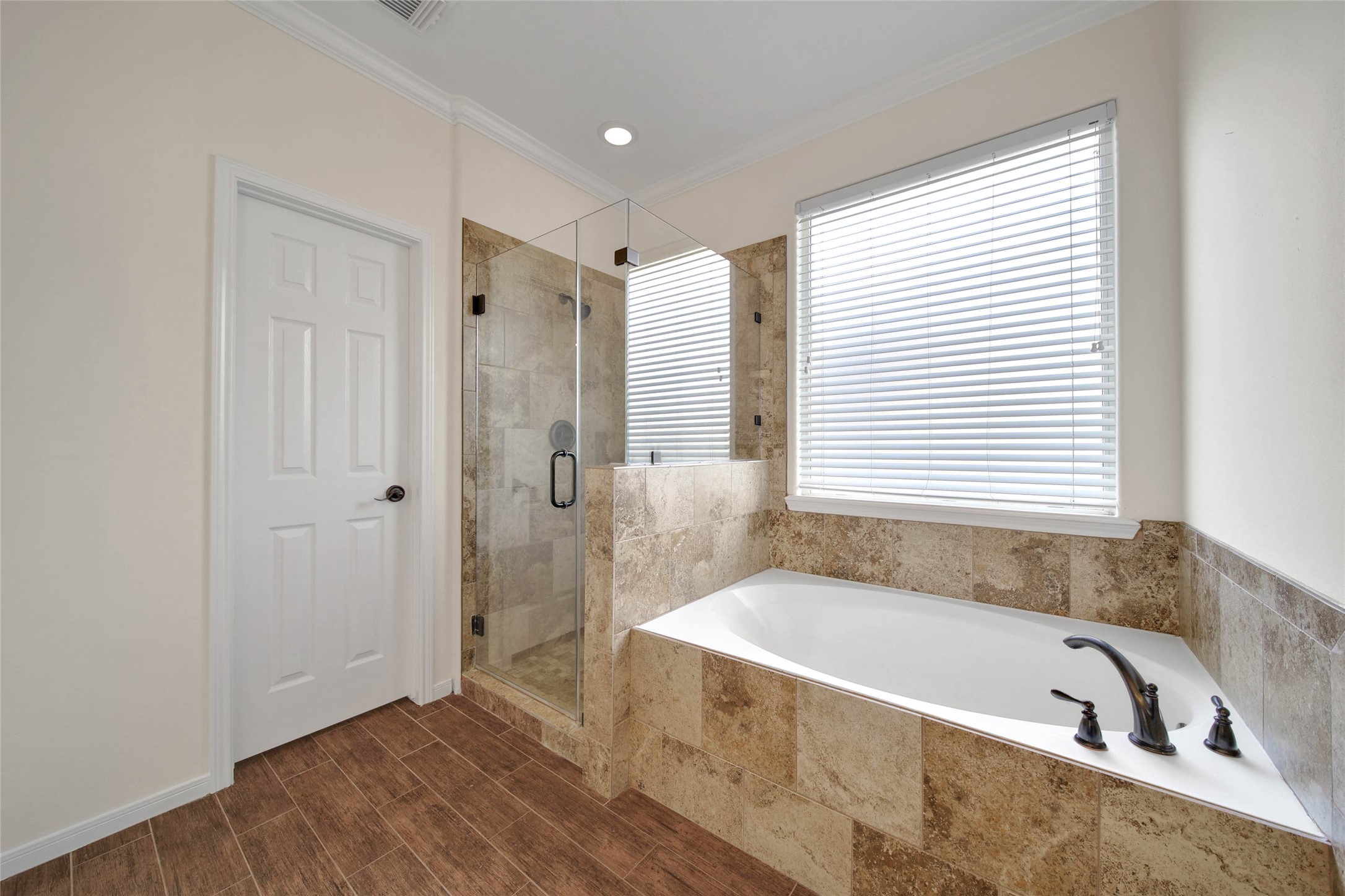 2215 2 Trail Drive Spring, TX 77373 - Photo 26 of 46 Primary Bathroom - soaker tub and separate shower with frameless glass enclosure.