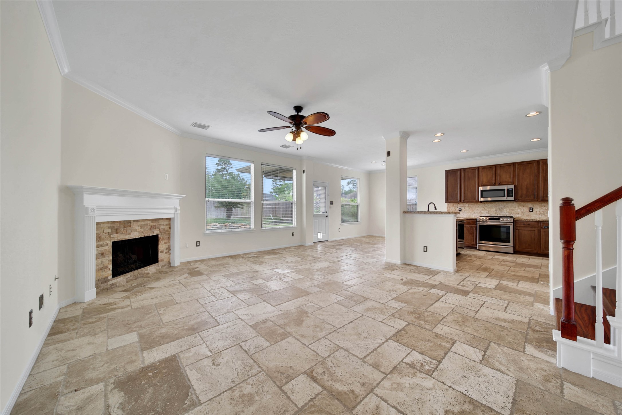 2215 2 Trail Drive Spring, TX 77373 - Photo 8 of 46 The main downstairs areas feature an elegant Versailles Pattern Travertine Tile.