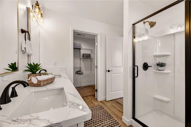 a bathroom with a tub shower and sink