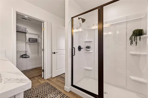 a bathroom with a glass shower door