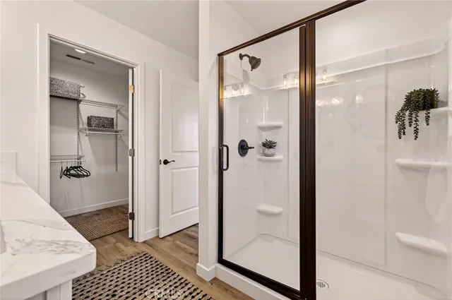 a bathroom with a glass shower door