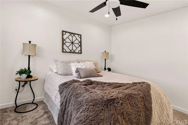 a bathroom with a double vanity sink mirror and toilet