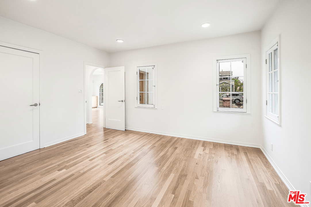 3735 Moore Street Los Angeles, CA 90066 - Photo 18 of 34 an empty room with wooden floor and windows