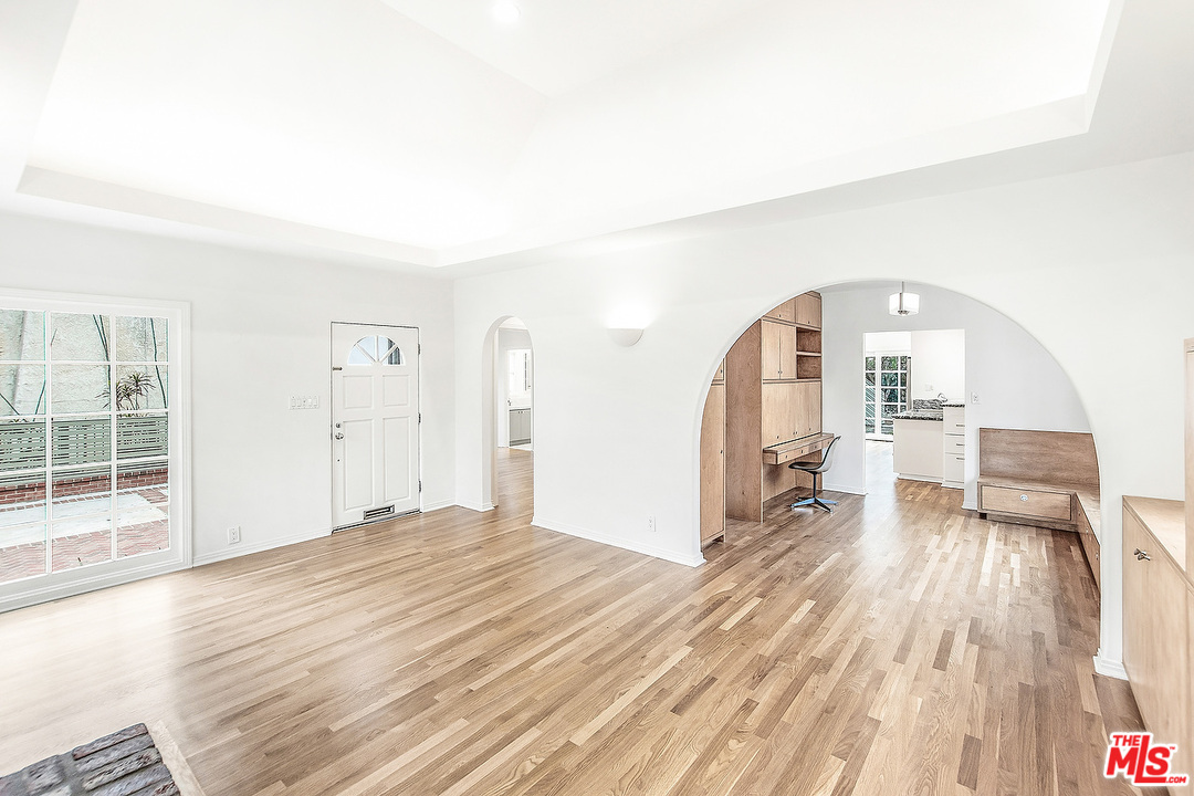 3735 Moore Street Los Angeles, CA 90066 - Photo 3 of 34 wooden floor in an empty room with a fireplace