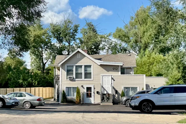 a view of a car parked in front of a house