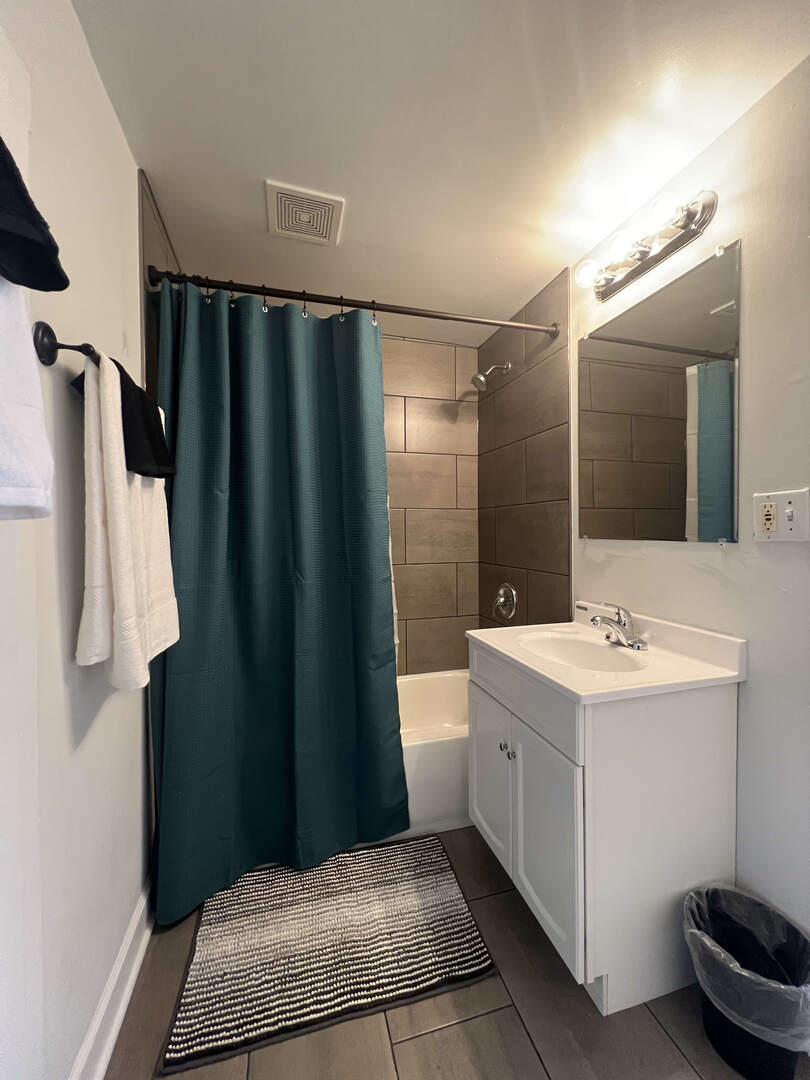 912 East St Charles Road Lombard, IL 60148 - Photo 14 of 27 a bathroom with a sink and a mirror